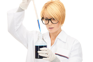 Image showing lab worker holding up test tube