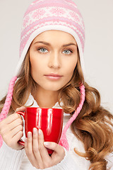 Image showing beautiful woman with red mug