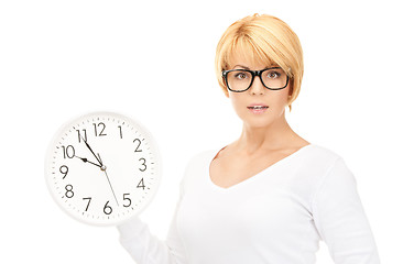 Image showing woman holding big clock