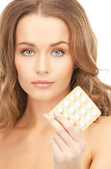 Image showing young beautiful woman with pills 