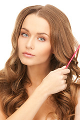 Image showing beautiful woman with comb