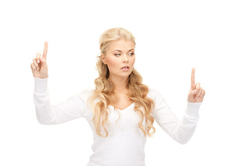 Image showing businesswoman working with something imaginary