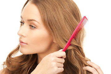 Image showing beautiful woman with comb