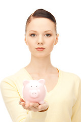 Image showing  lovely woman with piggy bank	 