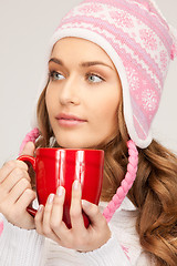 Image showing beautiful woman with red mug