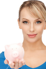 Image showing lovely woman with piggy bank