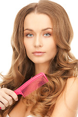 Image showing beautiful woman with comb