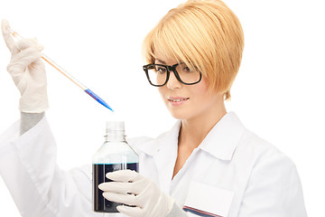 Image showing lab worker holding up test tube