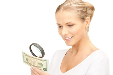 Image showing woman with magnifying glass and money