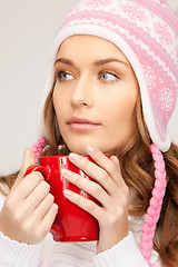 Image showing beautiful woman with red mug