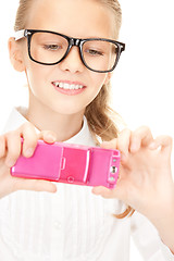 Image showing happy girl taking picture with cell phone