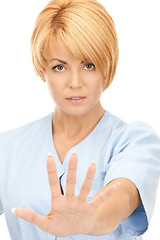 Image showing attractive female doctor showing stop gesture