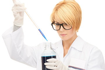 Image showing lab worker holding up test tube