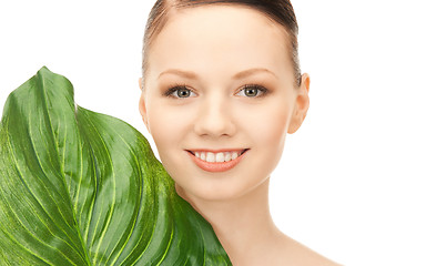 Image showing woman with green leaf