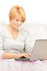 Image showing happy woman with laptop computer