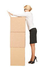 Image showing  attractive businesswoman with big boxes	 