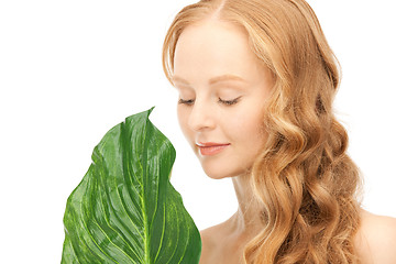 Image showing woman with green leaf