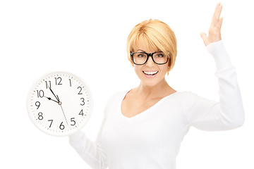 Image showing woman holding big clock