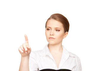 Image showing businesswoman working with something imaginary