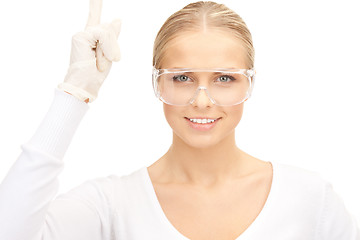 Image showing woman in protective glasses and gloves