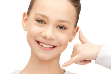 Image showing teenage girl making a call me gesture