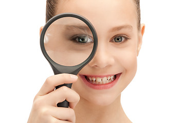 Image showing teenage girl with magnifying glass