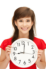 Image showing teenage girl holding big clock