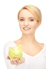 Image showing lovely woman with piggy bank