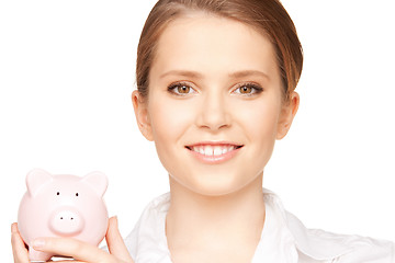 Image showing lovely woman with piggy bank