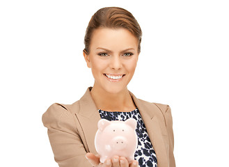 Image showing lovely woman with piggy bank