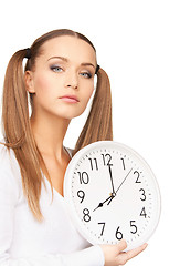 Image showing woman holding big clock