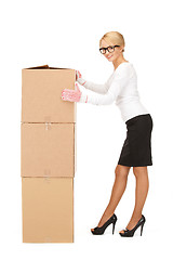 Image showing attractive businesswoman with big boxes