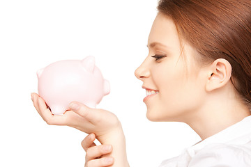 Image showing lovely woman with piggy bank