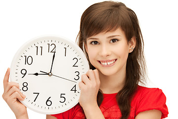 Image showing teenage girl holding big clock