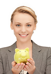 Image showing lovely woman with piggy bank