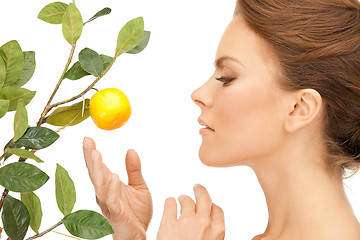 Image showing lovely woman with lemon twig