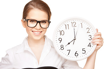 Image showing woman holding big clock