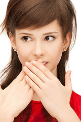 Image showing teenage girl with palms over mouth