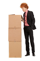 Image showing attractive businessman with big boxes