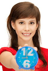 Image showing teenage girl holding alarm clock