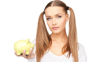 Image showing lovely woman with piggy bank