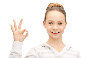 Image showing lovely teenage girl showing ok sign