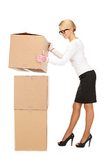 Image showing attractive businesswoman with big boxes