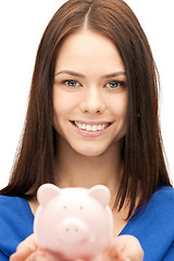 Image showing lovely woman with piggy bank