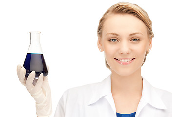 Image showing lab worker holding up test tube