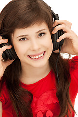 Image showing happy teenage girl in big headphones