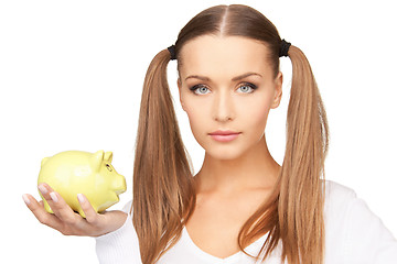 Image showing lovely woman with piggy bank