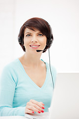 Image showing helpline operator with laptop computer