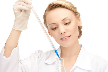 Image showing lab worker holding up test tube