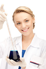 Image showing lab worker holding up test tube